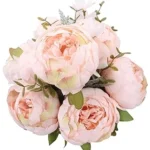 This image shows a lush bouquet of pink peonies alongside elegant red roses, illustrating the expensive floral comparison.