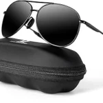 This image shows a pair of luxurious, gold-rimmed aviator sunglasses with tinted lenses.