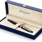 The image shows a collection of luxury ballpoint pens, highlighting top expensive writing instruments.
