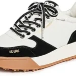 This image shows a selection of luxurious black and white shoes, ideal for a top ten list.