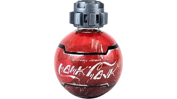 The image shows a vintage, ornate Coca Cola bottle, likely one of the most expensive.