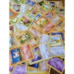 The image shows a collection of rare Pokemon cards, possibly from the Top 10 Most Expensive Fossil Pokemon Cards list.