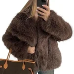 The image shows a luxurious, deep brown fur coat, suggesting a high-end fashion item from a top 10 list.