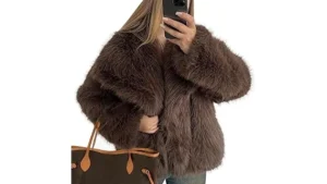 The image shows a luxurious, deep brown fur coat, suggesting a high-end fashion item from a top 10 list.