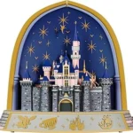 The image shows several dazzling, ornate Christmas tree ornaments, potentially from the Top 10 Most Expensive Hallmark Ornaments list.
