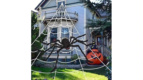 The image shows an elaborately decorated, spooky graveyard scene with a large, ornate tombstone, part of expensive Halloween decor.