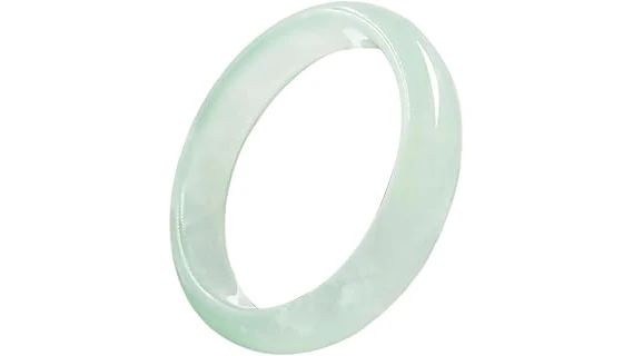 The image shows a close-up of a luxurious, vibrant green jade bangle, likely one of the top 10 most expensive.