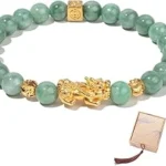 The image shows a dazzling jade necklace with intricate gold details, part of the Top 10 Most Expensive Jade Jewelry collection.