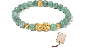The image shows a dazzling jade necklace with intricate gold details, part of the Top 10 Most Expensive Jade Jewelry collection.