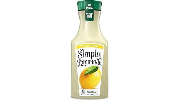 The image shows a luxurious glass of lemonade with gold flakes, hinting at expensive ingredients for the Top 10 list.