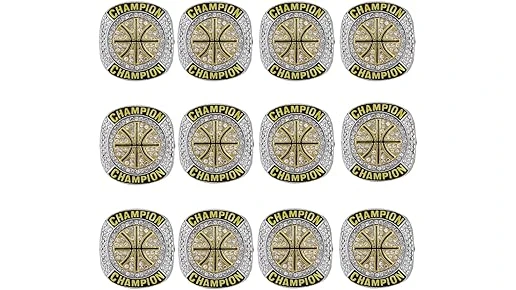 The image shows a collection of sparkling NBA championship rings, hinting at the top 10 most expensive NBA ring prices.