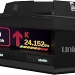 The image shows a sleek radar detector, possibly among the top 10 most expensive models.