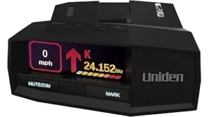 The image shows a sleek radar detector, possibly among the top 10 most expensive models.