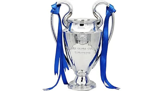 The image shows a gleaming soccer trophy, likely among the world's most expensive.