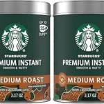 The image shows a lavish, gold-accented coffee drink, possibly representing an expensive Starbucks creation.
