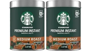 The image shows a lavish, gold-accented coffee drink, possibly representing an expensive Starbucks creation.