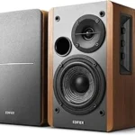 The image shows elegant, high-end stereo speakers, perfect for a top 10 list.