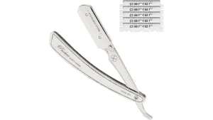 The image shows a gleaming, ornate straight razor, a highlight from the top 10 most expensive.