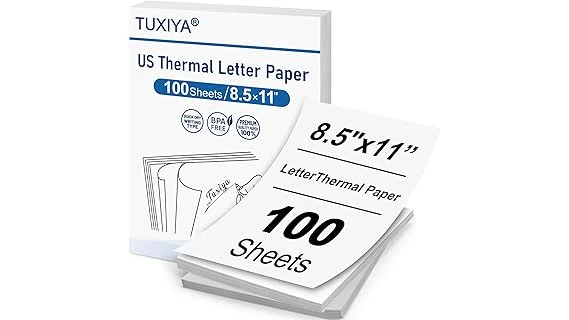 The image shows a stack of premium thermal paper rolls, suggesting the Top 10 Most Expensive Thermal Paper collection.
