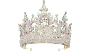 The image shows a woman wearing a dazzling diamond and emerald tiara from the Top 10 Most Expensive Tiaras list.