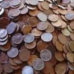 The image shows a collection of valuable vintage wheat penny coins, potentially some of the most expensive.