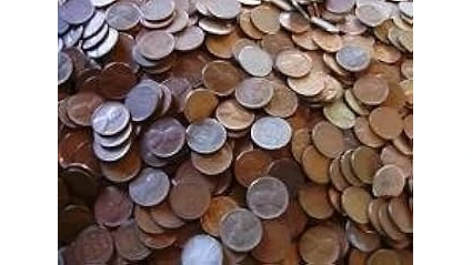 The image shows a collection of valuable vintage wheat penny coins, potentially some of the most expensive.