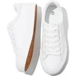 The image shows a stylish collection of elegant white shoes, likely from the Top 10 Most Expensive White Shoes list.