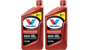 The image shows three distinct bottles of premium motor oil, highlighting the most expensive Valvoline options.