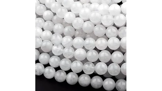 The image shows a stunning white jade sculpture, highlighting the top four most expensive white jade pieces.