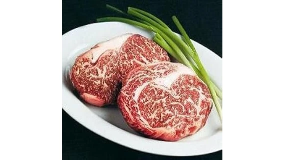 The image shows a beautifully marbled cut of premium Wagyu beef, hinting at the most expensive options.