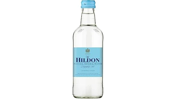 The image shows an elegant display of several premium mineral water bottles, highlighting the most expensive options.