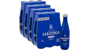 The image shows a collection of expensive bottled spring water brands, highlighting the top 9 most expensive.